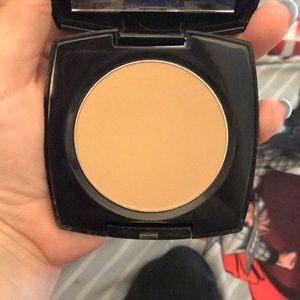Avon presses powder.